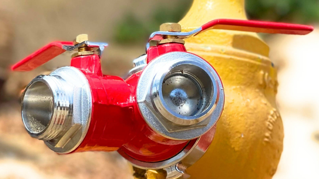 Close-up of a fire hydrant valve with a blurred background
