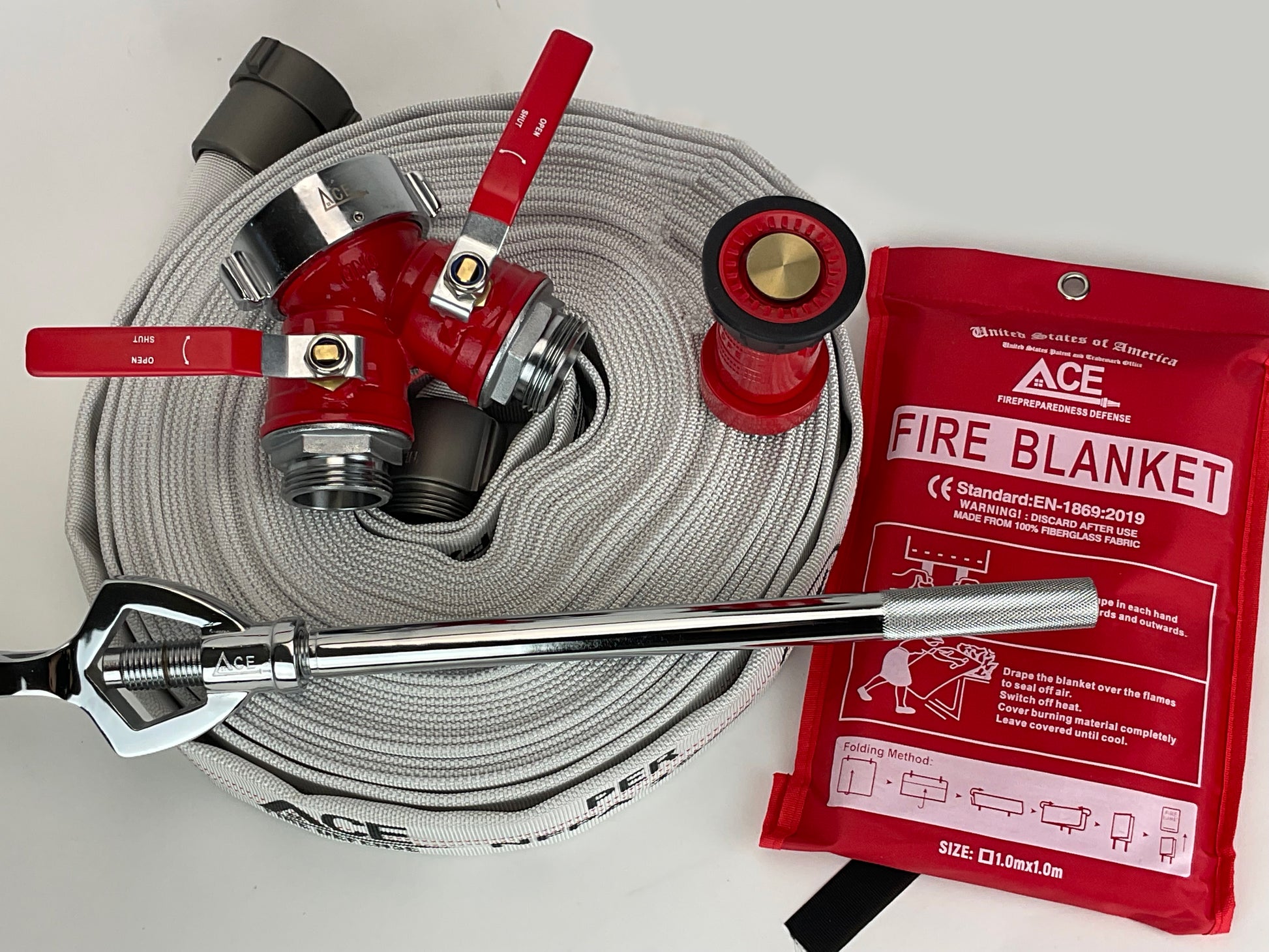 Fire hose with nozzle, wrench, and fire blanket on a white background