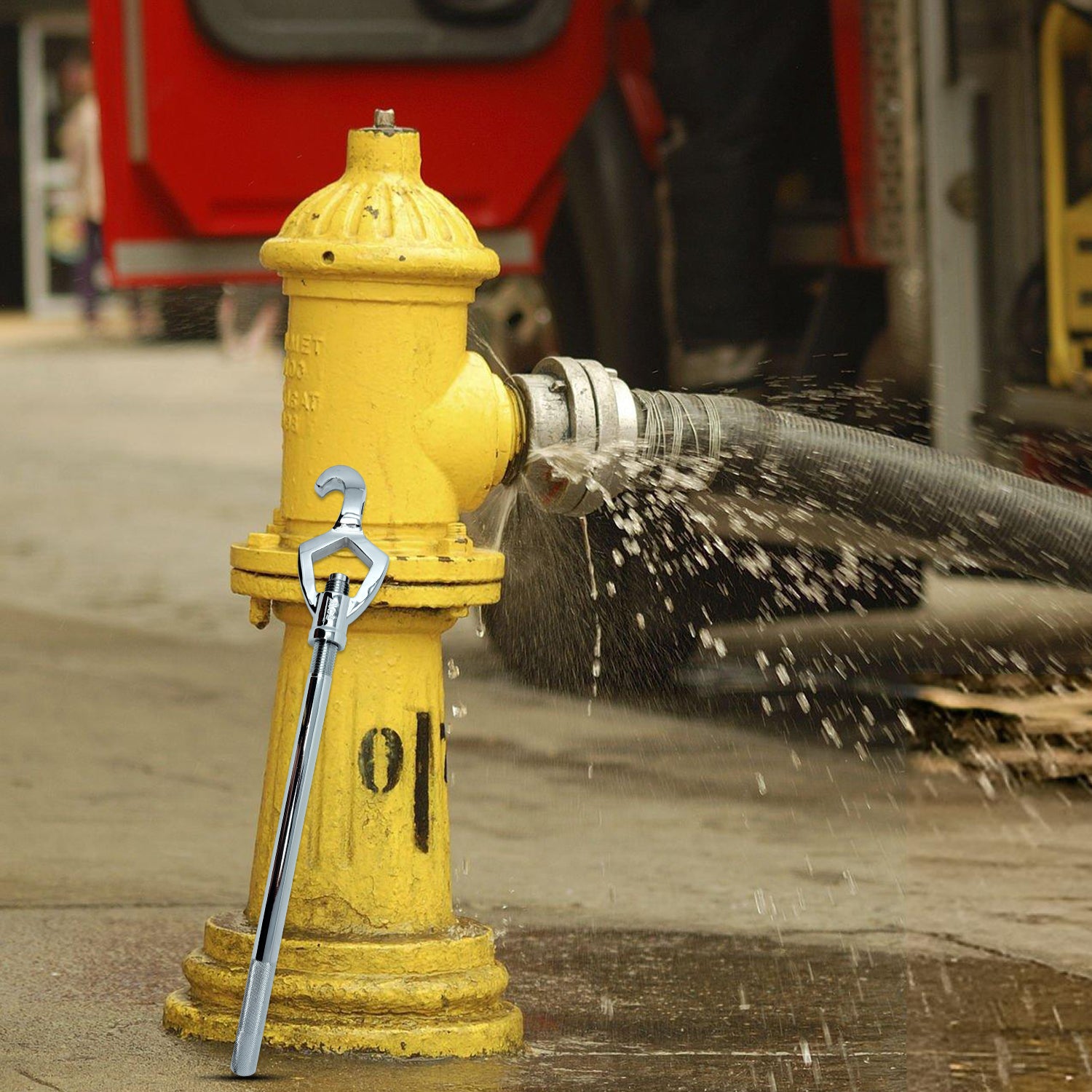 Yellow fire hydrant with water flowing out, connected to a hose, with a red vehicle in the background.