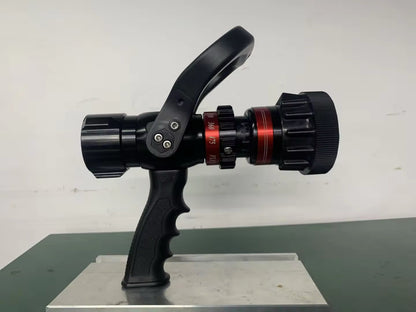 Fire hose nozzle on a stand with a white background